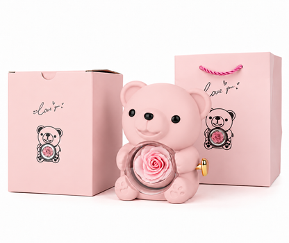 Rosa Rosenbär mit Geschenkbox und Geschenktüte